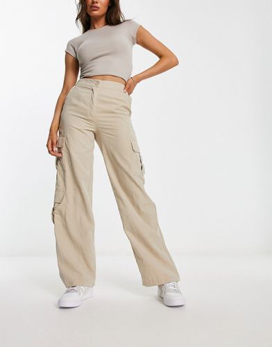 Pantaloni cargo a fondo ampio color pietra - New Look - Modalova