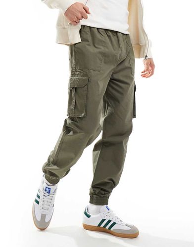 Pantaloni cargo oliva affumicato in ripstop con fondo elasticizzato - New Look - Modalova