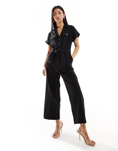 Tuta jumpsuit nera con bottoni allacciata in vita - New Look - Modalova