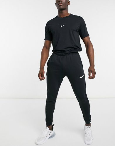 Dri-Fit - Joggers in pile affusolati neri - Nike Training - Modalova