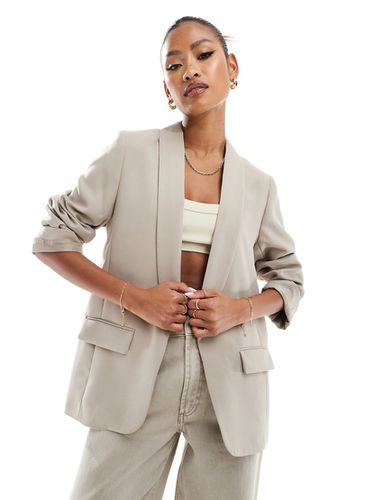 Blazer beige con maniche arrotolate - River Island - Modalova