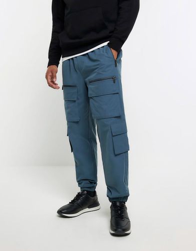 Pantaloni cargo multitasche - River Island - Modalova