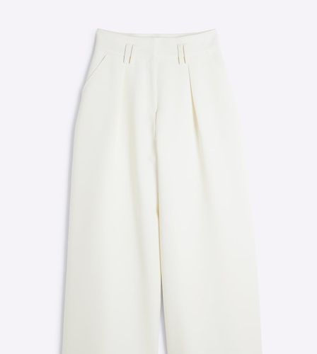 Pantaloni a fondo ampio color crema a vita alta - River Island Petite - Modalova