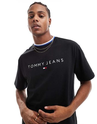 T-shirt nera con logo lineare e profili a contrasto - Tommy Jeans - Modalova