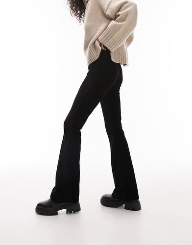 Pantaloni a zampa elasticizzati in velluto a coste neri - Topshop - Modalova