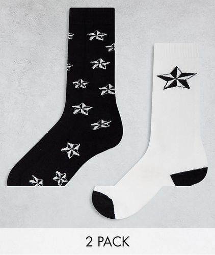 Ski - Confezione da 2 paia di calzini bianchi e neri con stampa di stelline - Threadbare - Modalova