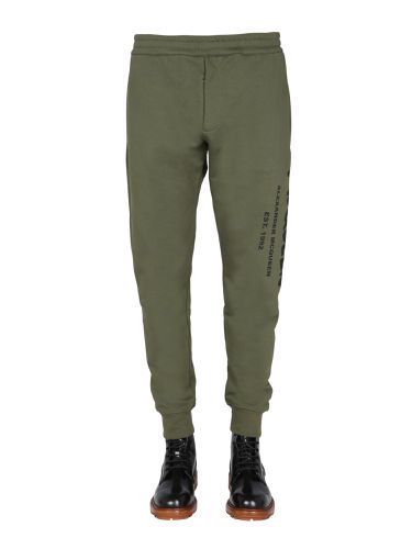 Jogging pants with graffiti logo - alexander mcqueen - Modalova