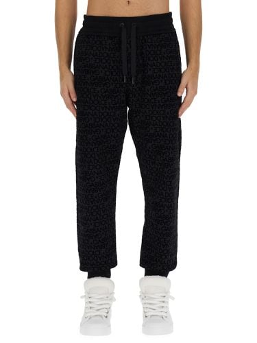 Jogging pants with logo - dolce & gabbana - Modalova