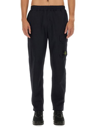 Jogging pants with logo - stone island - Modalova