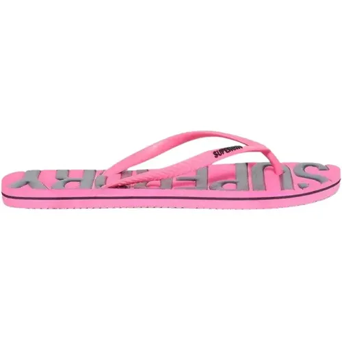 Diese vintage Flip-Flops präsentieren unser ikonisches Logo auf elegante, aber bequeme Weise. Sie sind eine vielseitige Wahl für Abenteuer am Wasser - MAG9785544 - Modalova