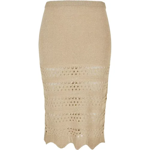 Questa affascinante gonna a maglia all'uncinetto è divisa in due parti. La parte superiore, della lunghezza di una minigonna, è opaca, grazie a un r - MAG5336589 - Modalova