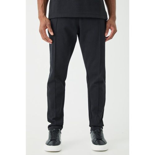 Pantaloni tuta affusolati Slim Fit con nervature e nervature - boohoo - Modalova