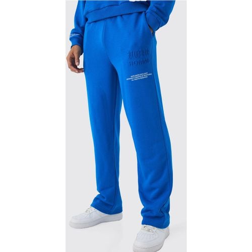 Pantaloni tuta rilassati con stampa Homme in rilievo - boohoo - Modalova