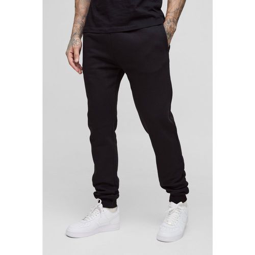 Pantaloni tuta neri Tall Skinny Fit - boohoo - Modalova