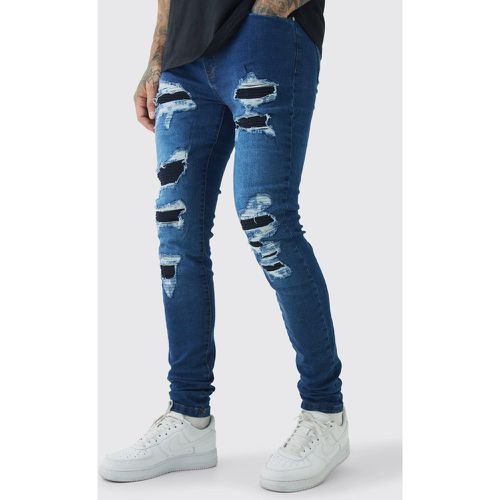 Jeans da Biker Tall Super Skinny Fit Stretch con strappi & rattoppi in blu vintage - boohoo - Modalova