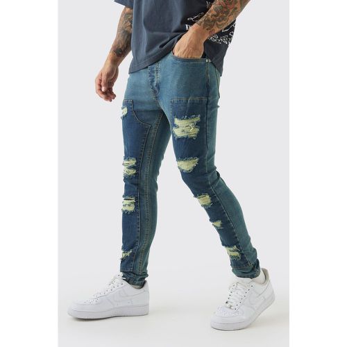 Jeans stile Biker Super Skinny Fit in denim Stretch con strappi & rattoppi - boohoo - Modalova