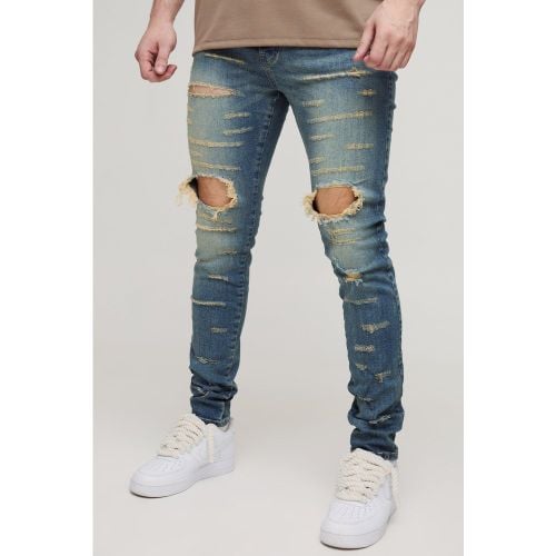 Jeans Tall Skinny Fit con strappi estremi e spacco sul ginocchio - boohoo - Modalova