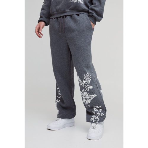 Pantaloni tuta oversize con slogan Graffiti e polsini alle caviglie - boohoo - Modalova