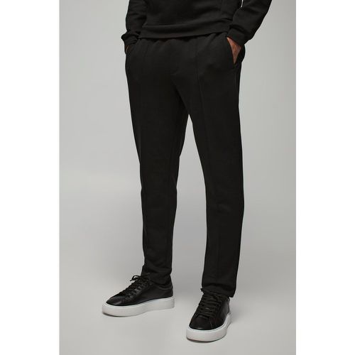 Pantaloni tuta affusolati Slim Fit effetto velluto con nervature - boohoo - Modalova