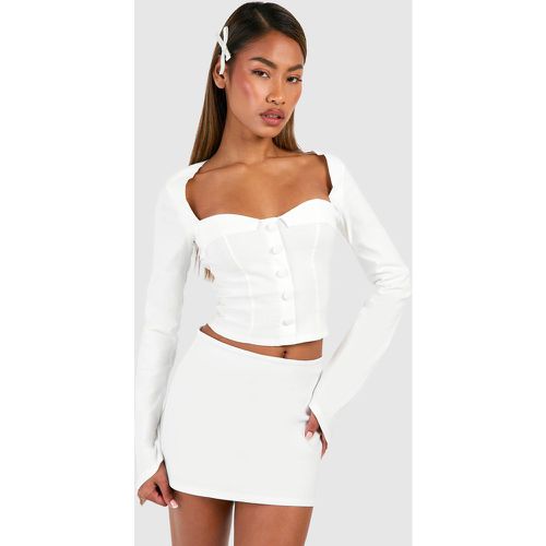 Corsetto a maniche lunghe con bottoni - boohoo - Modalova