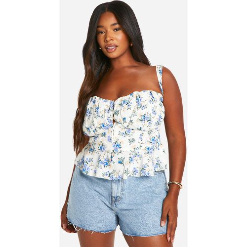 Top a corsetto Plus Size a fiori piccoli con volant sul fondo - boohoo - Modalova