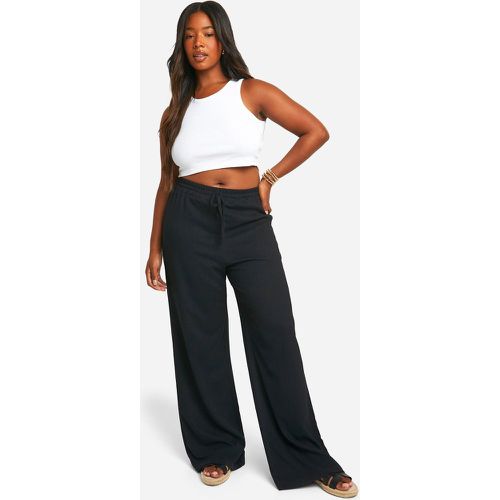 Pantaloni Plus Size a gamba ampia rilassati con trama - boohoo - Modalova