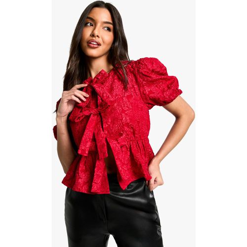 Top svasato in jacquard a fiori con trama, laccetti frontali e maniche a sbuffo - boohoo - Modalova