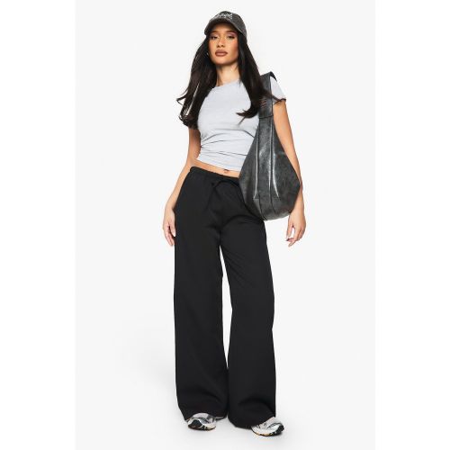 Pantaloni a zampa in tessuto con laccetti - boohoo - Modalova