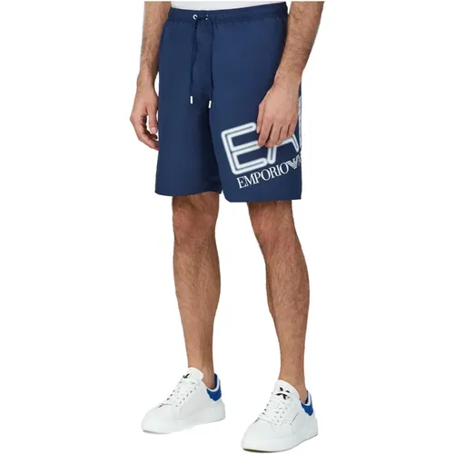 Sportliche Badeshorts - Emporio Armani EA7 - Modalova