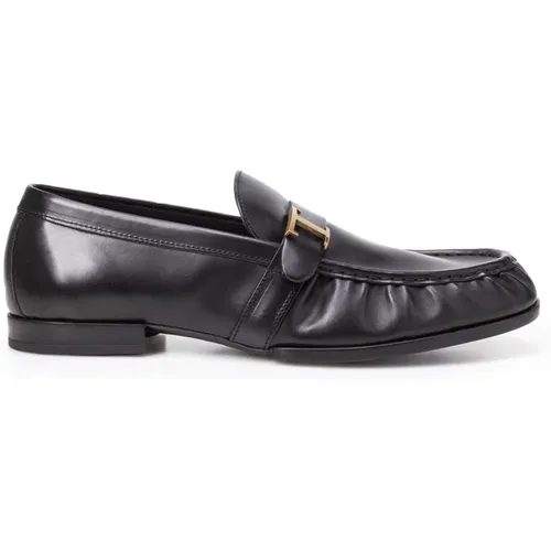 Schwarze flache Schuhe mit goldfarbenem Logo - TOD'S - Modalova