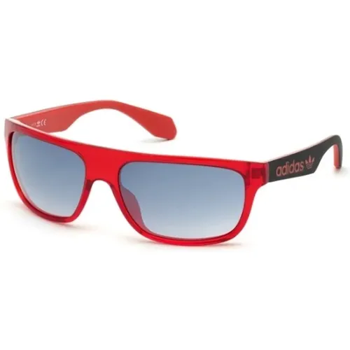 Sonnenbrille mit rotem Rahmen - adidas Originals - Modalova