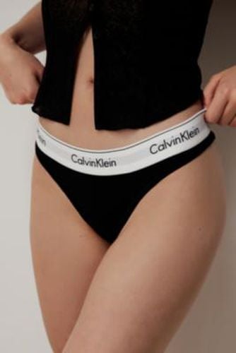 Modern Cotton Classic Logo Thong - Black M at Urban Outfitters - Calvin Klein - Modalova