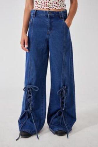 Lace-Up Patch Jeans - Indigo 26 at Urban Outfitters - Minga London - Modalova