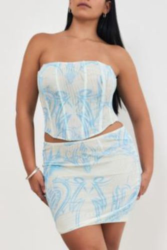 UO Exclusive Tattoo Mini Skirt - Blue XS at Urban Outfitters - miaou - Modalova