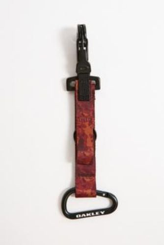 Wanderlust Keychain - Red at Urban Outfitters - Oakley - Modalova