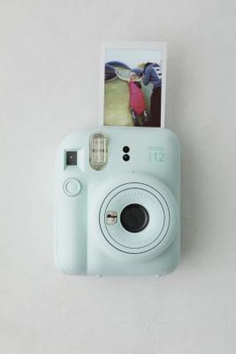 Instax Mini 12 Instant Camera - 11.9cm x 7.5cm x 15.7cm at Urban Outfitters - Fujifilm - Modalova