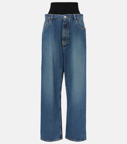 AlaÃ¯a High-rise jersey-trimmed straight jeans - Alaia - Modalova