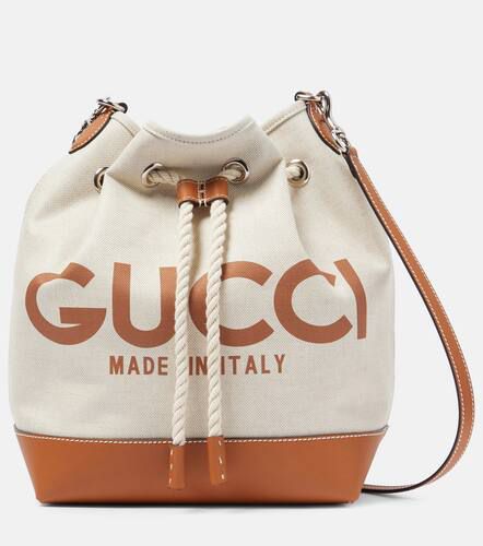 Logo leather-trimmed canvas bucket bag - Gucci - Modalova
