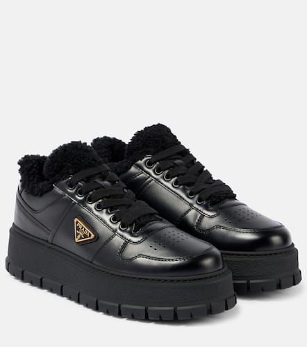 Shearling-lined leather platform sneakers - Prada - Modalova