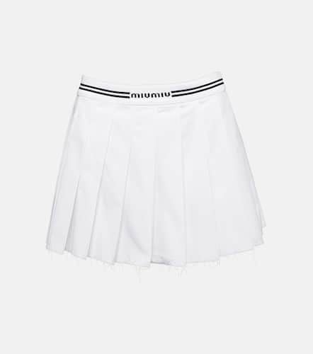 Logo pleated cotton miniskirt - Miu Miu - Modalova