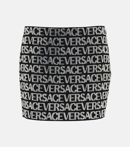Versace Minifalda adornada con logo - Versace - Modalova