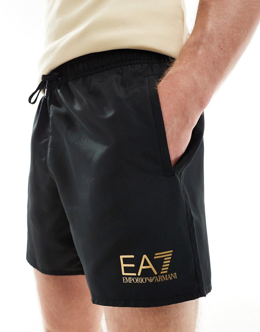 Armani - Pantaloncini da bagno neri con logo dorato - EA7 - Modalova