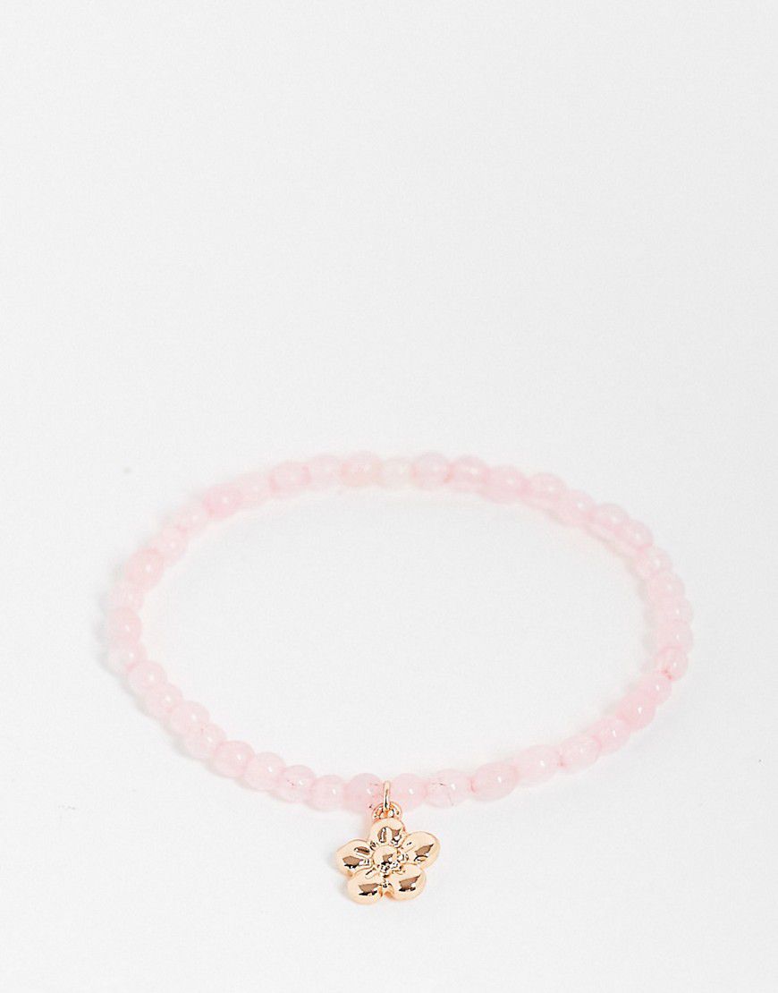 Bracciale rosa elasticizzato con pietre semipreziose e ciondolo a fiore - ASOS DESIGN - Modalova