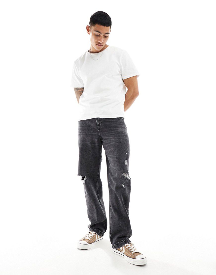 Jeans larghi slavato con abrasioni effetto vintage - ASOS DESIGN - Modalova
