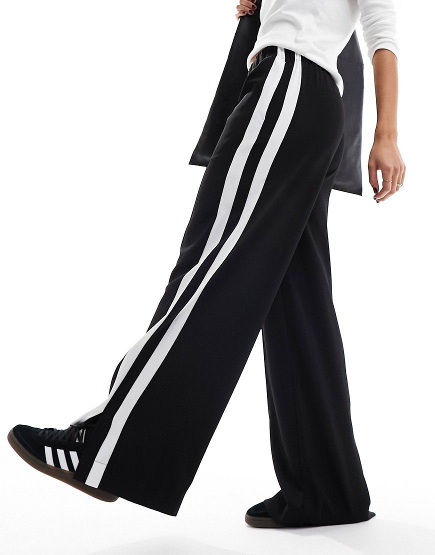 Pantaloni neri con doppio pannello a contrasto - ASOS DESIGN - Modalova