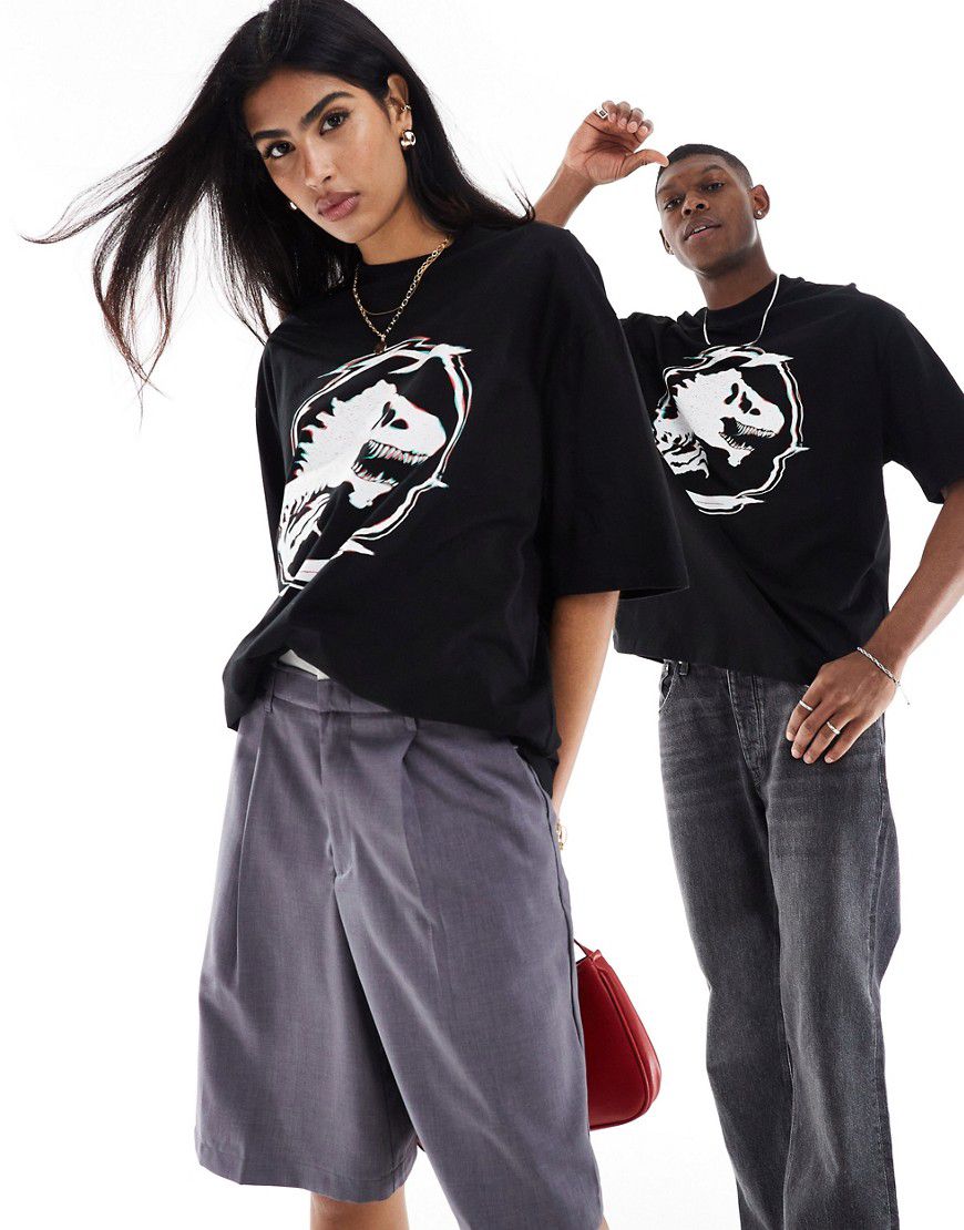 T-shirt oversize unisex nera con stampa del logo di Jurassic Park su licenza - ASOS DESIGN - Modalova