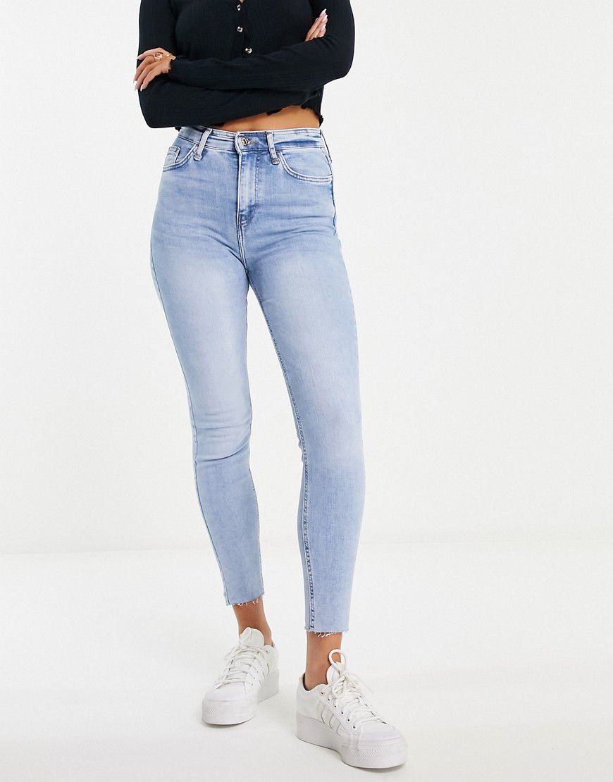 Jeans skinny con fondo grezzo medio - River Island - Modalova