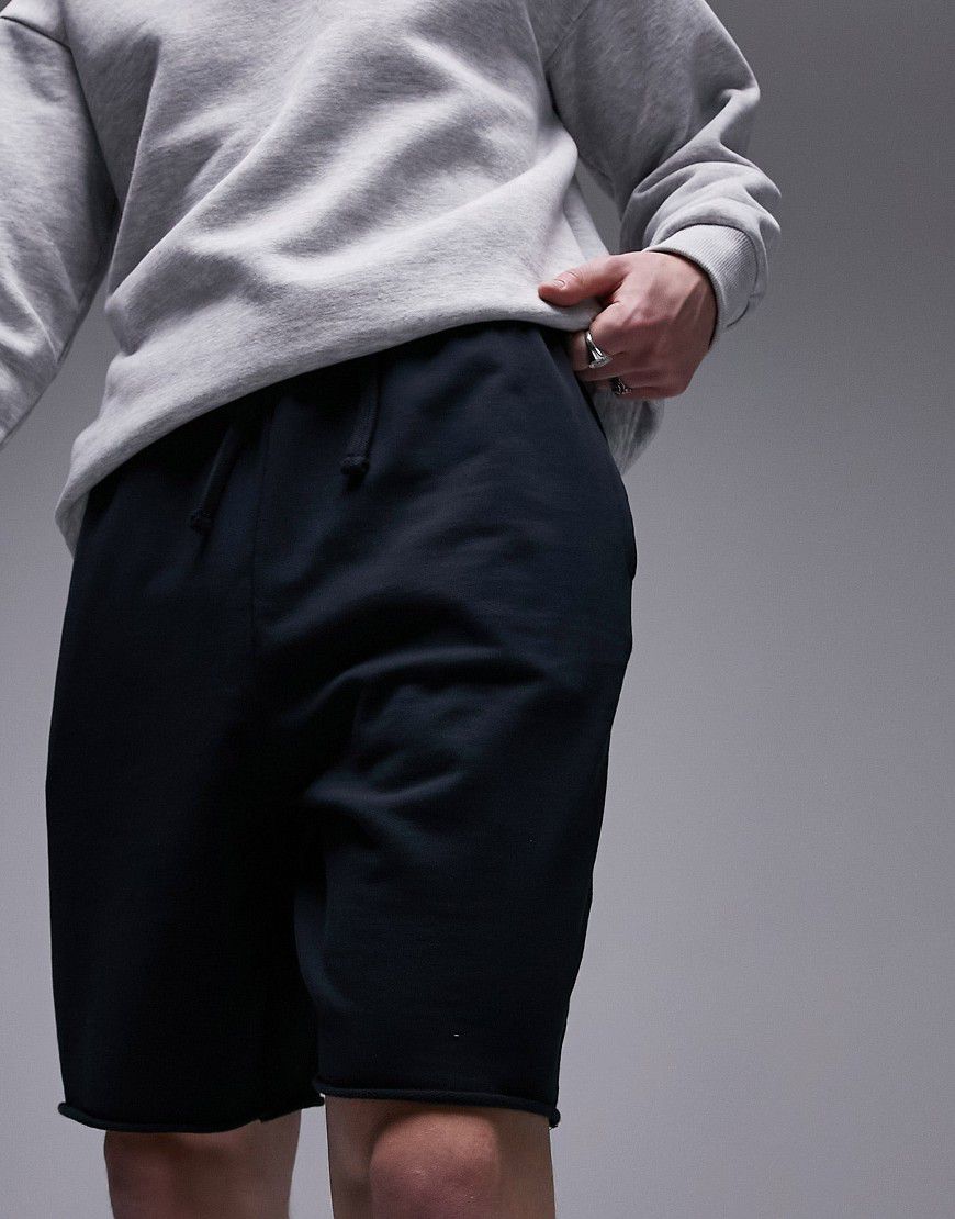 Pantaloncini oversize color slavato con orlo grezzo - Topman - Modalova
