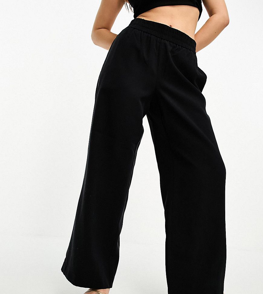 Pantaloni con fondo ampio neri - Vero Moda Petite - Modalova