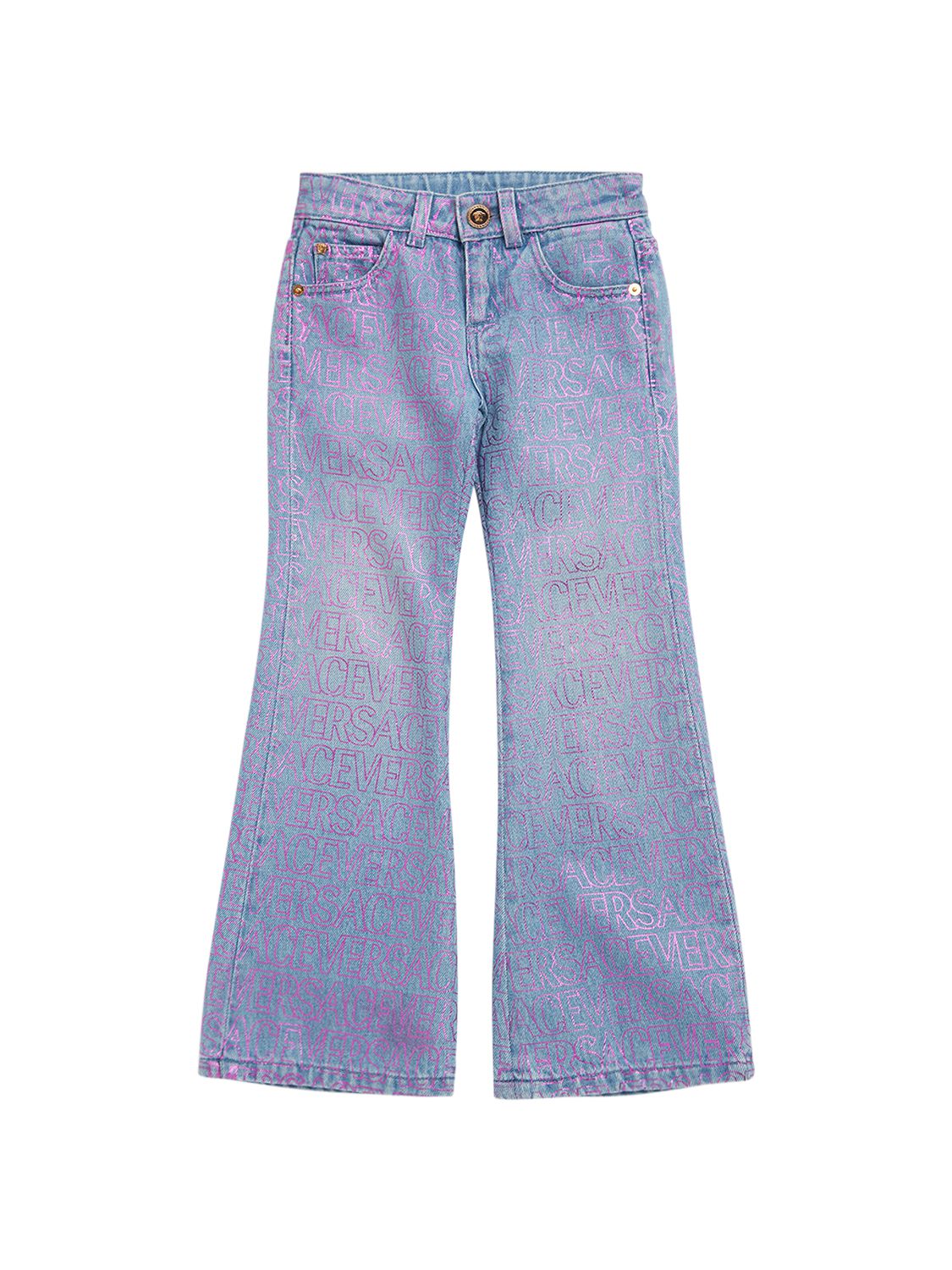 Jeans In Denim Di Cotone Stampato - VERSACE - Modalova